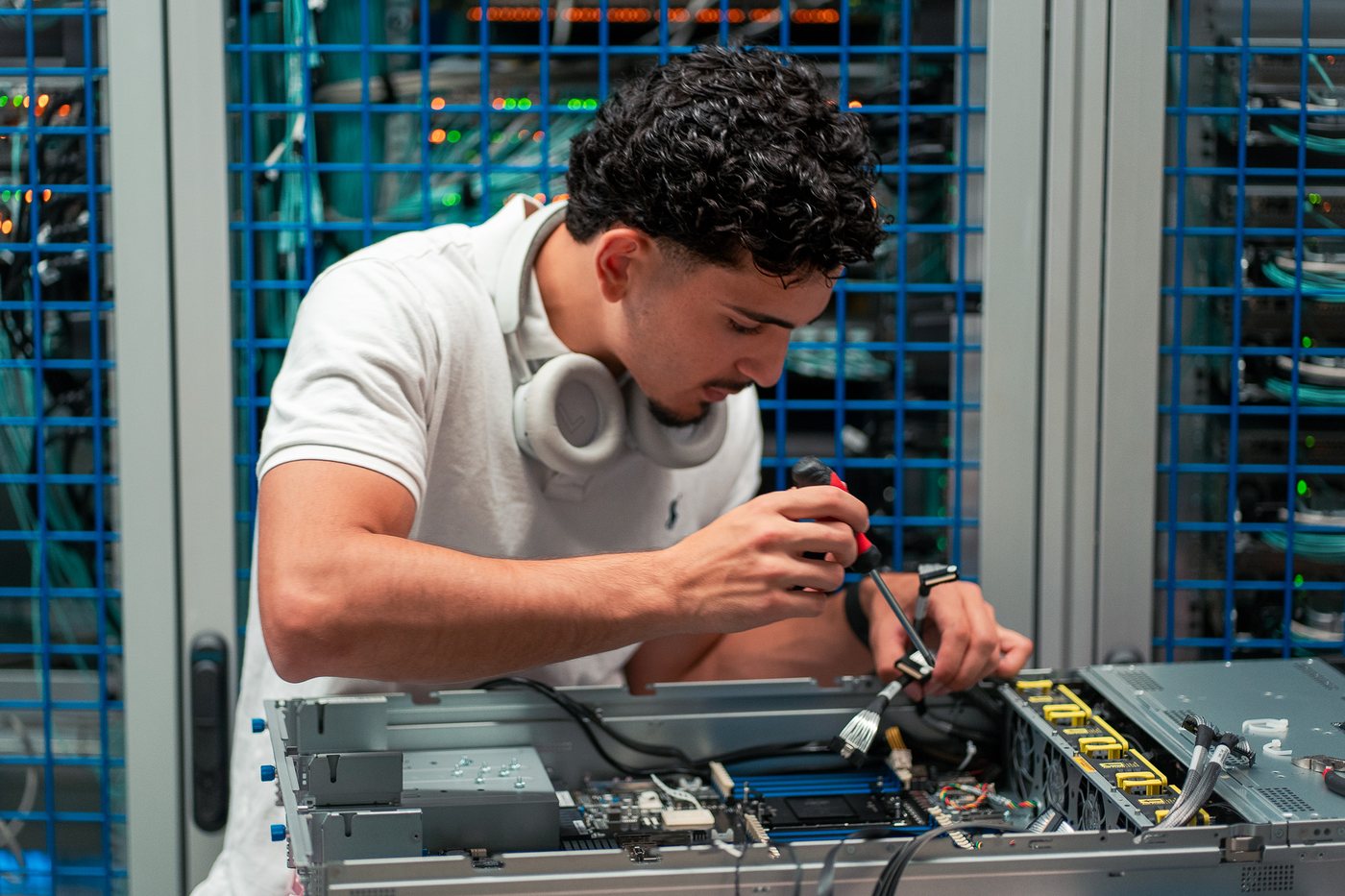 Abdulaziz Albunni, SicherNets field engineer, performing hands-on server repair